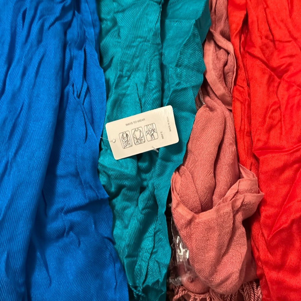 4 Pashtuns scarves re, pink, teal and blue. All new. Only one has a bag.